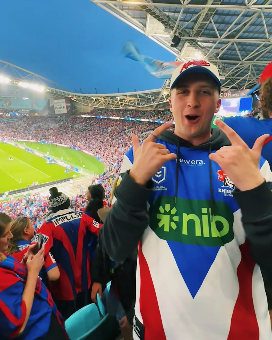 Cameron in a Newcastle Knights jersey at a game