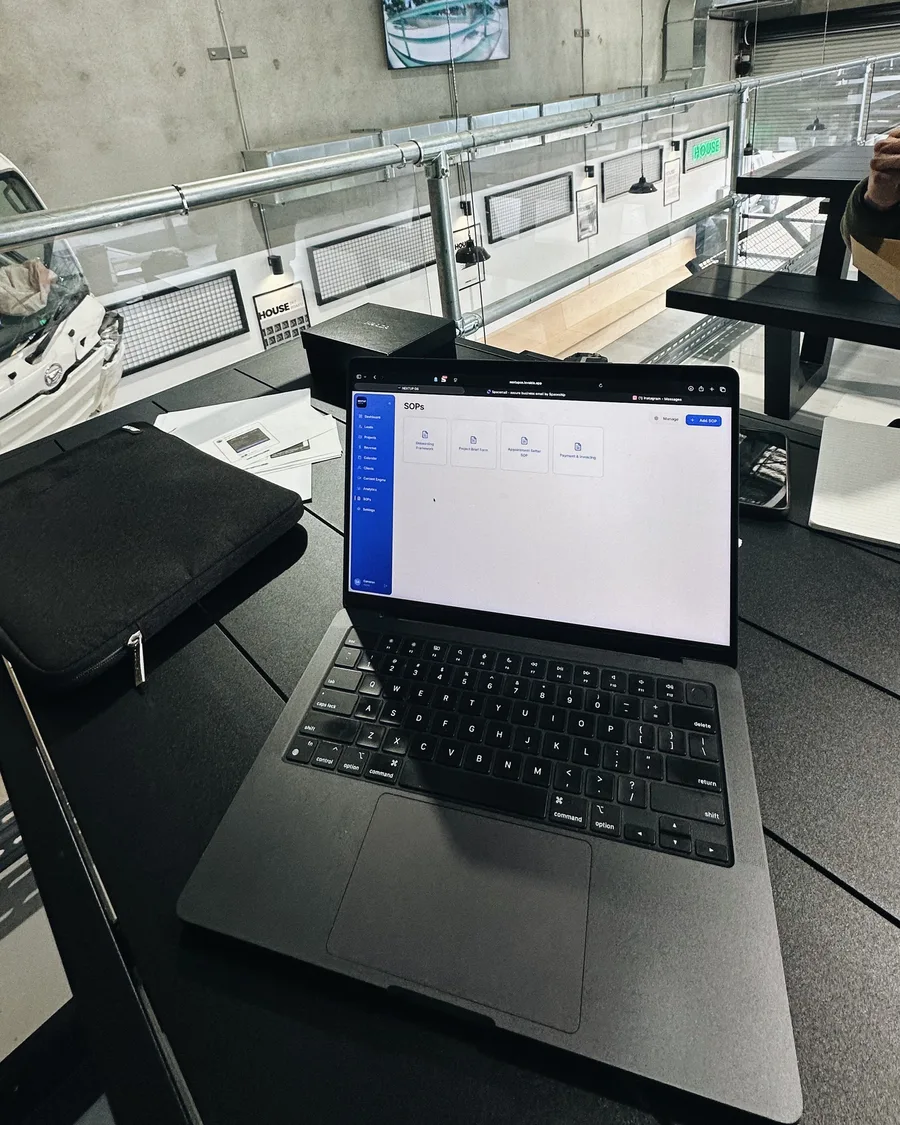 Cameron's laptop set up at a co-working space