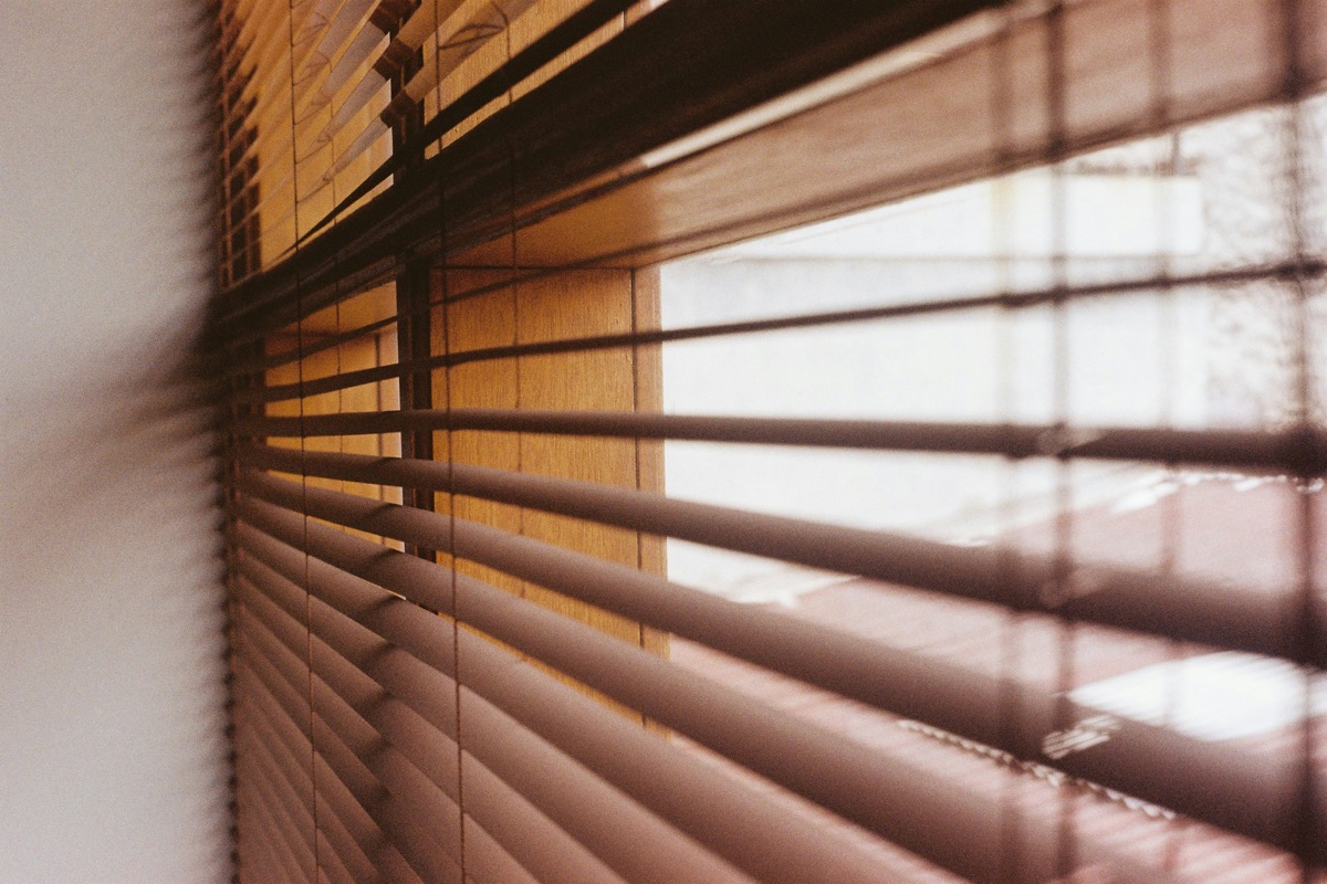 Sunlight through timber venetian blinds