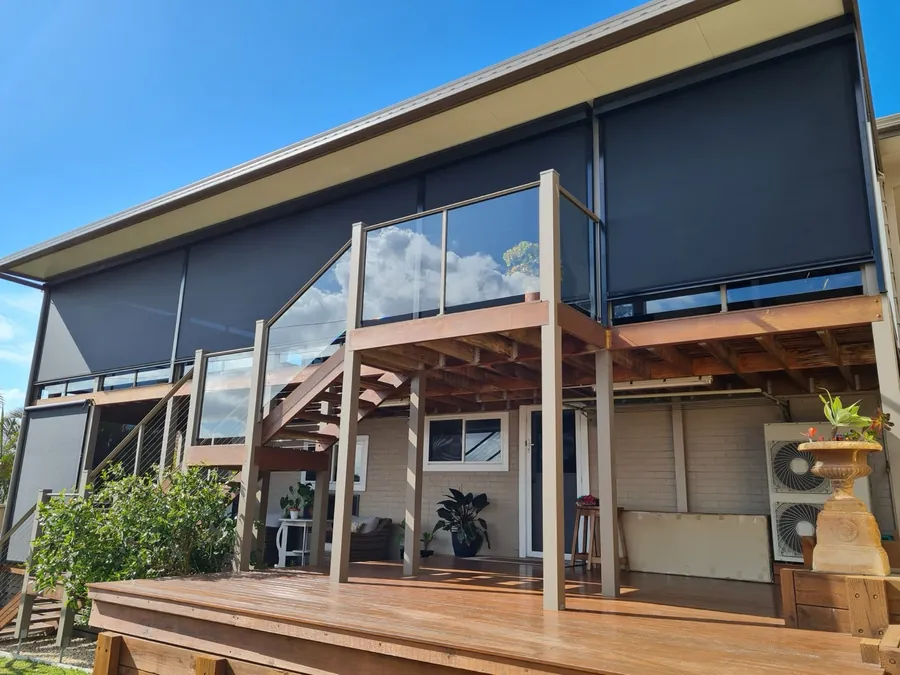 Outdoor blinds fitted to a raised deck